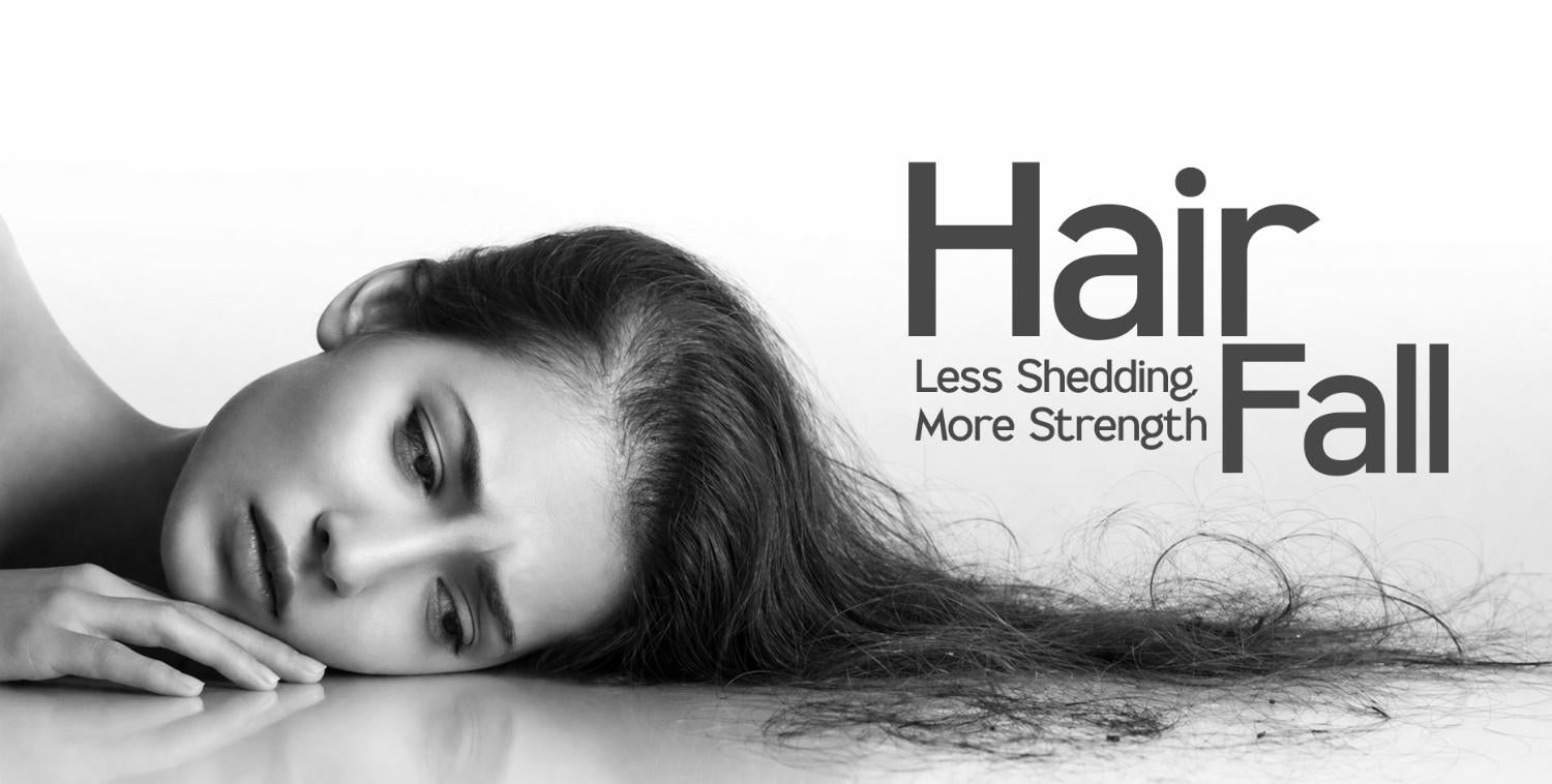 Monochrome image of a woman with long, dark hair, representing hair fall and shedding.