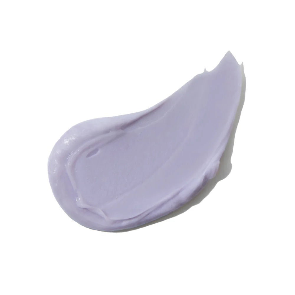 A creamy, vibrant purple swirl of Innersense Bright Balance Conditioner on a white background.