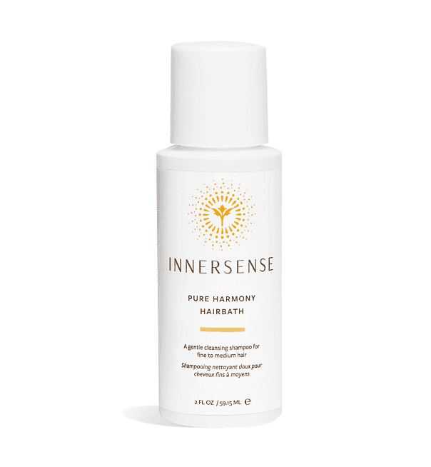 White Innersense Pure Harmony Hairbath shampoo bottle, 2 fl oz, with a gold sun logo.