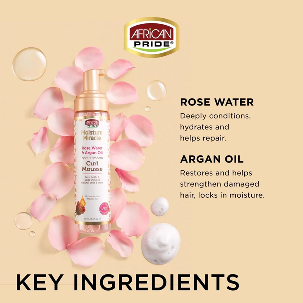 African Pride Moisture Miracle Curl Mousse in a peach bottle with rose petals and ingredient bubbles.