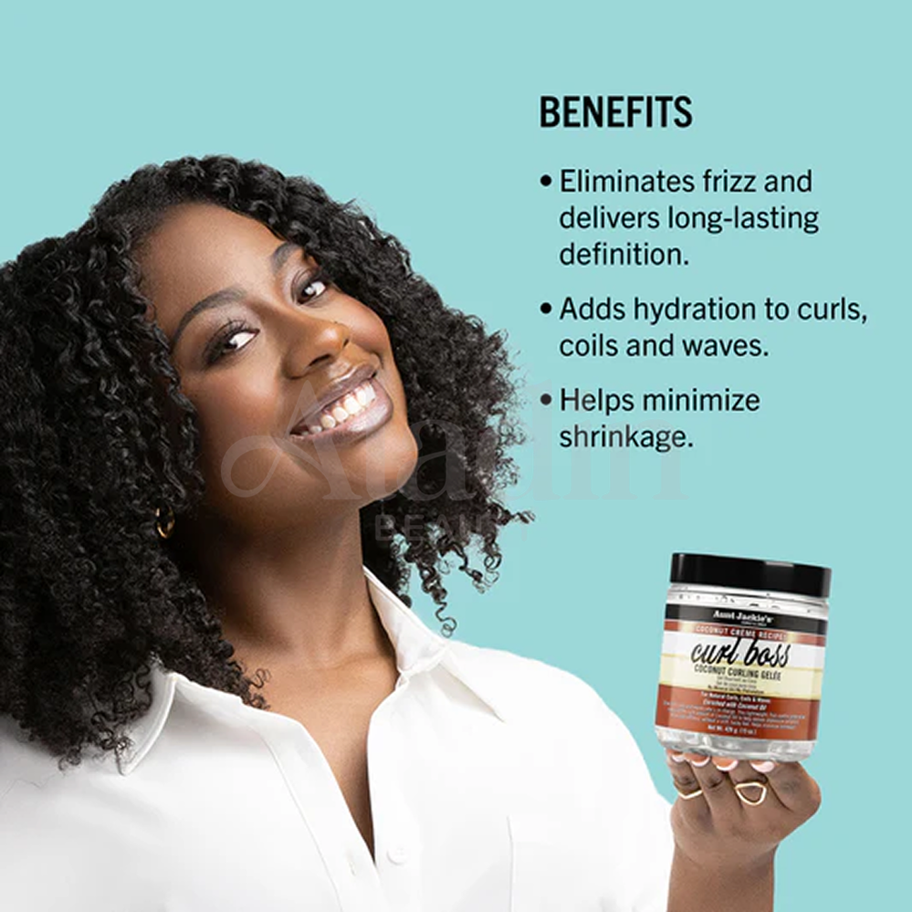 Smiling woman with curly hair holding Aunt Jackie's Curl Boss Coconut Curling Gelée.