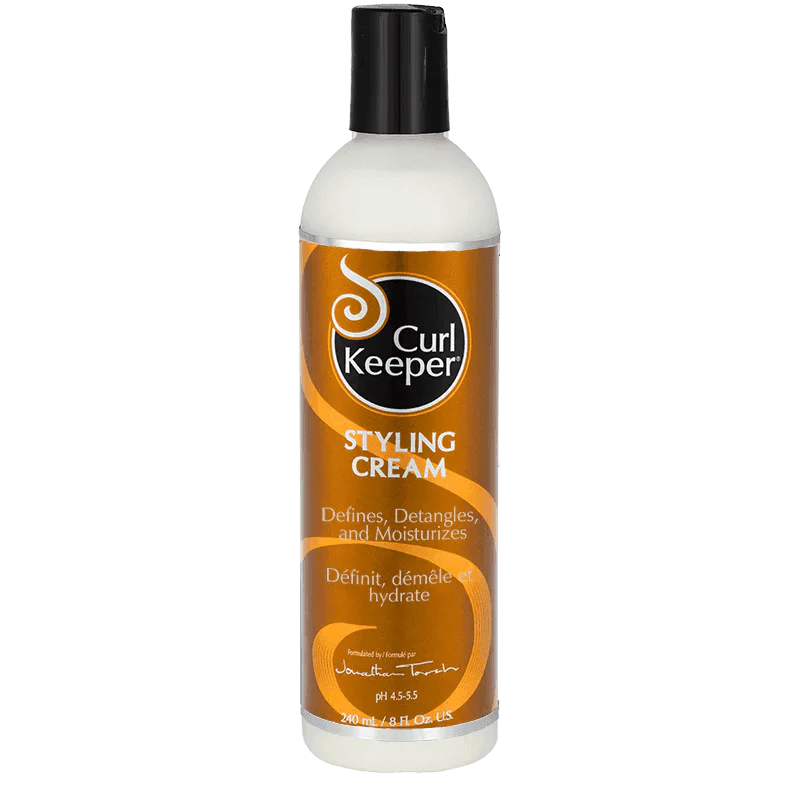 White Curl Keeper Styling Cream bottle with a black cap and metallic bronze label.
