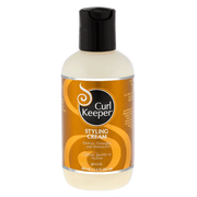 Curl Keeper Styling Cream in a 100ml off-white bottle with a black flip-top cap and gold label.