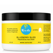 White jar of Curls Blueberry Bliss Reparative Hair Mask with yellow label and black lid, 240ml.