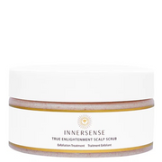 Innersense True Enlightenment Scalp Scrub in a white jar with a gold rim and logo, showing the pink scrub.