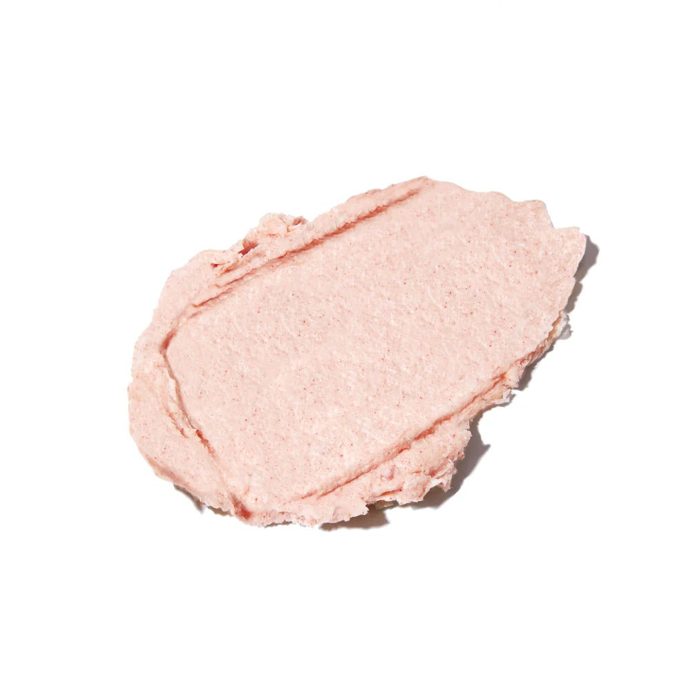 A swatch of Innersense True Enlightenment Scalp Scrub, a thick, light pink, textured paste with fine red salt particles.