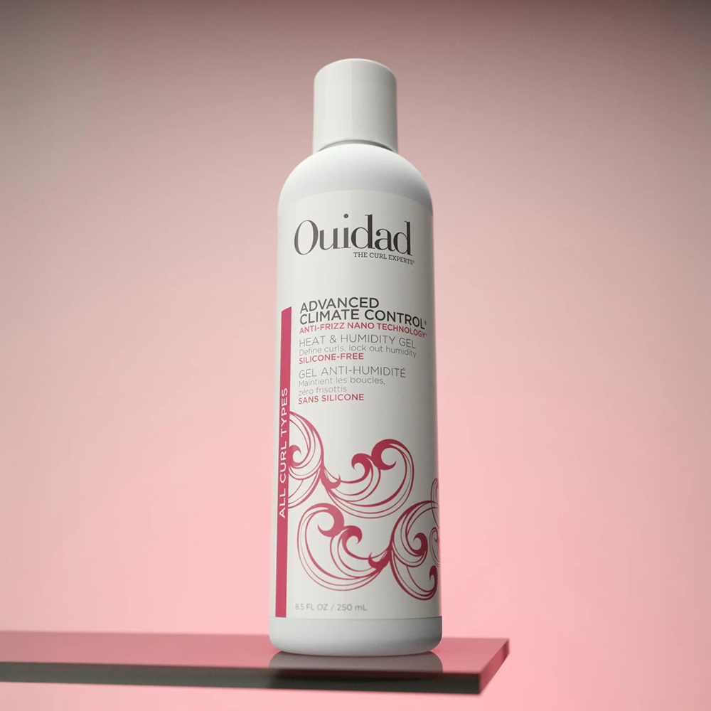 White Ouidad Advanced Climate Control Heat & Humidity Gel bottle with red text and swirl design.