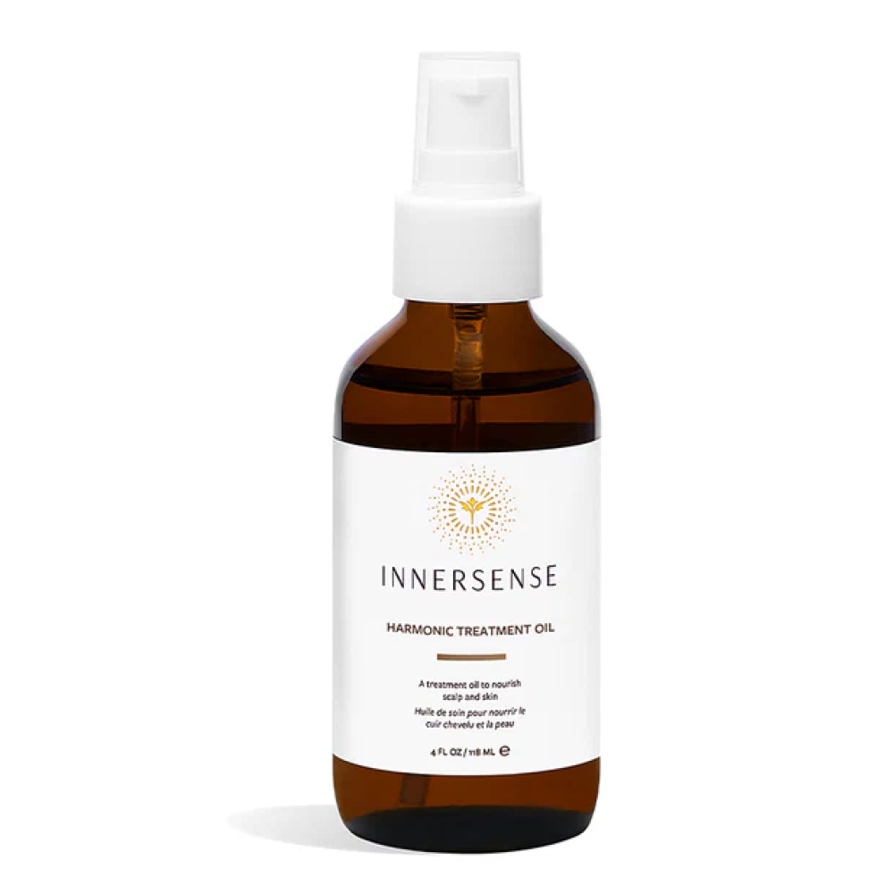 Innersense Harmonic Treatment Oil in a brown glass bottle with a white pump top and label.