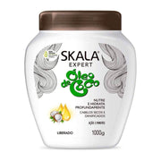 White Skala Coconut Oil Treatment Cream 1000g jar with brown lid and green text.