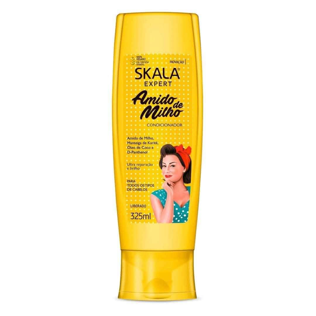 Skala Corn Starch Conditioner 325ml in a bright yellow bottle with a woman in a red headscarf.