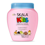 Pink Skala Kids 1000g conditioner bottle with blue cap and diverse cartoon children.