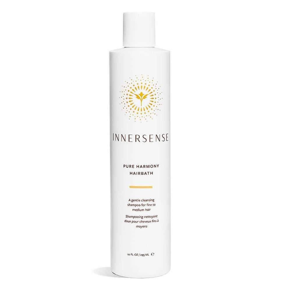 White Innersense Pure Harmony Hairbath bottle with gold sunburst logo and black text.